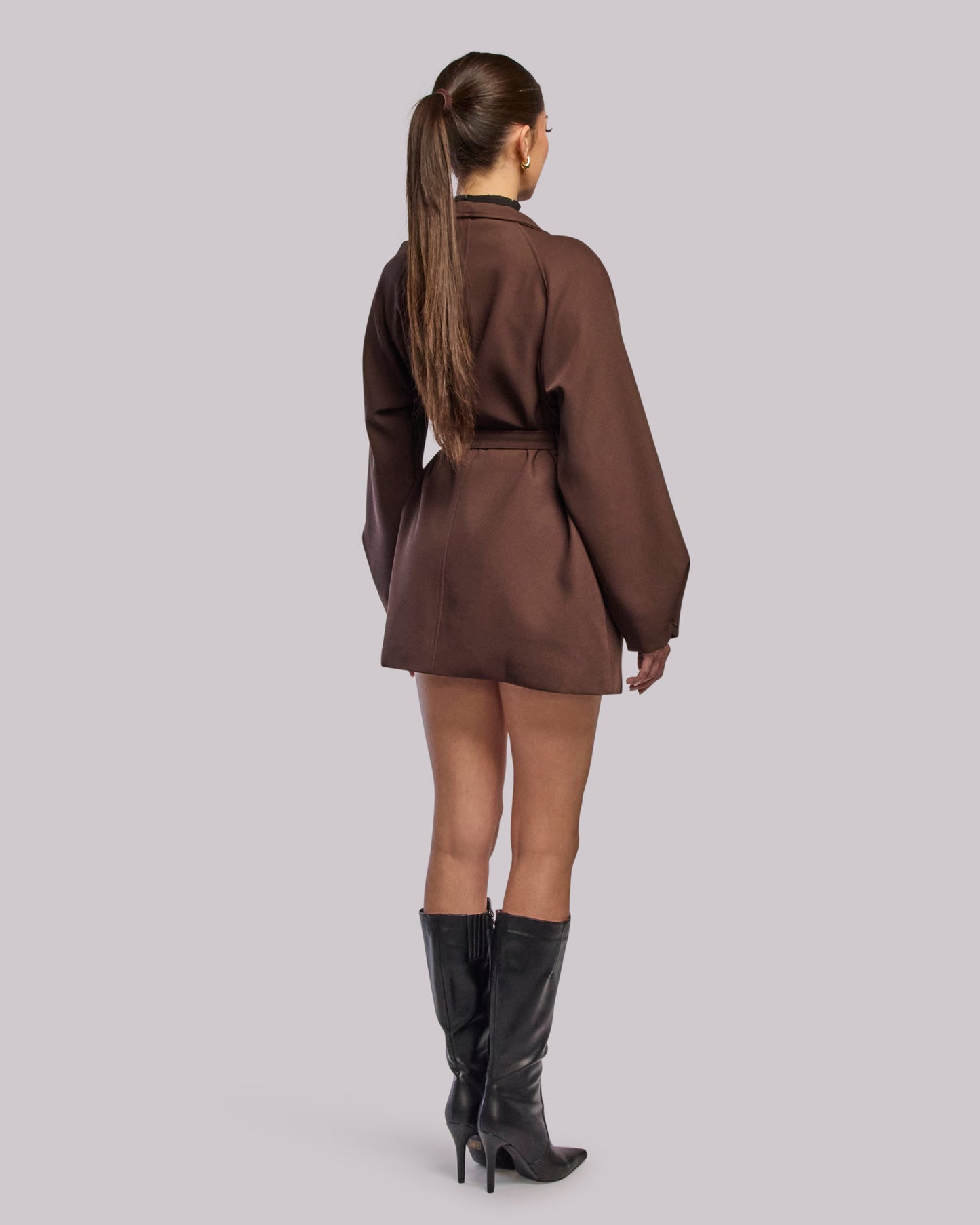 Model wearing Dawn brown wrap coat standing back angle