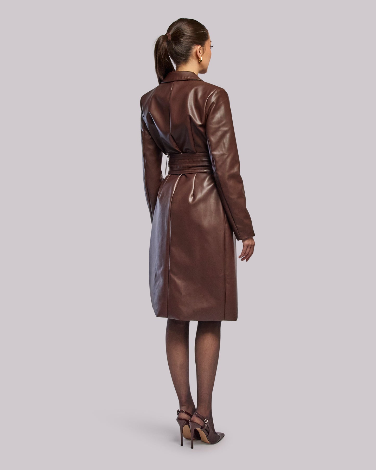 Model wearing Storm long coat standing back angle