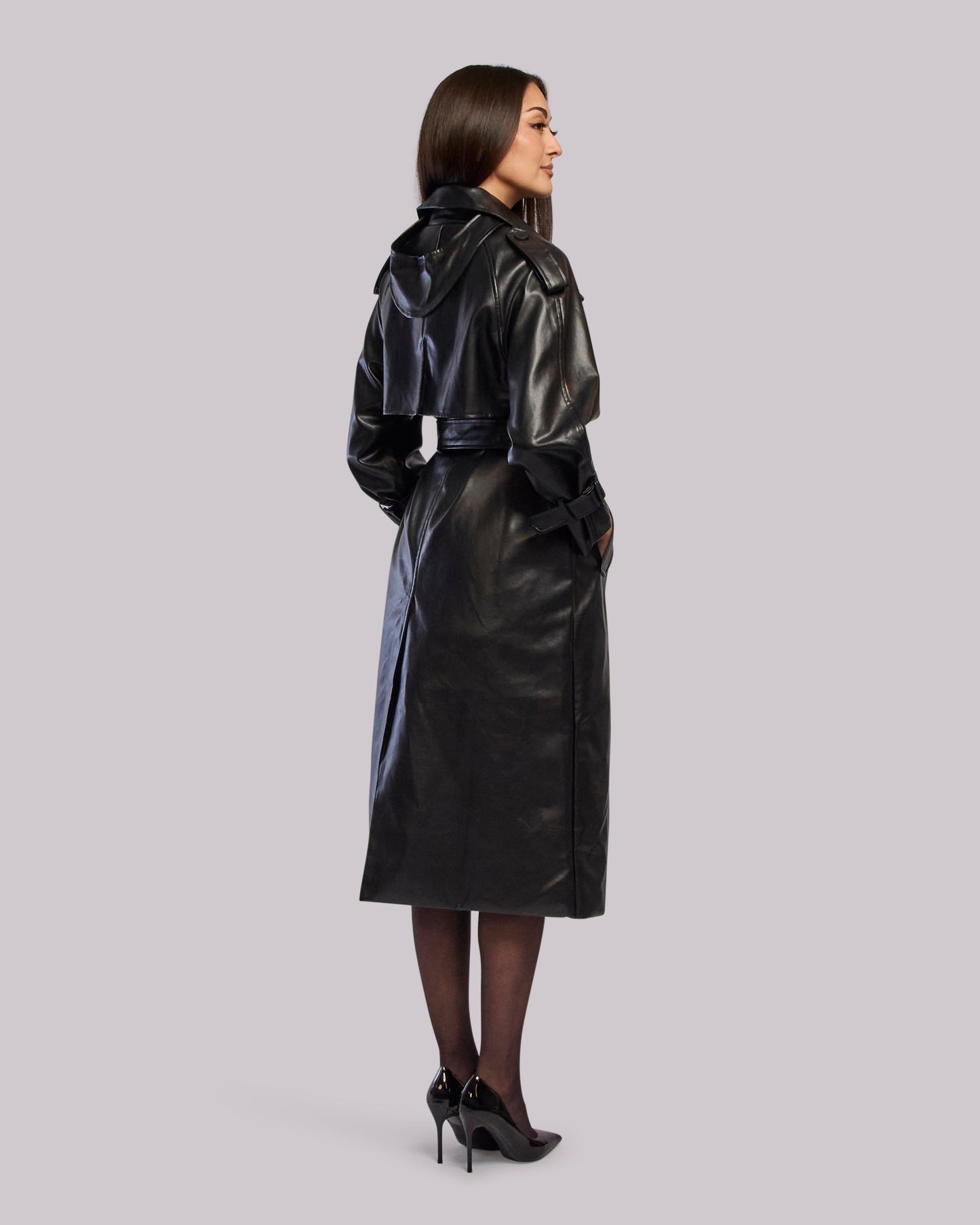 Model wearing Thunder leather trench coat standing back angle