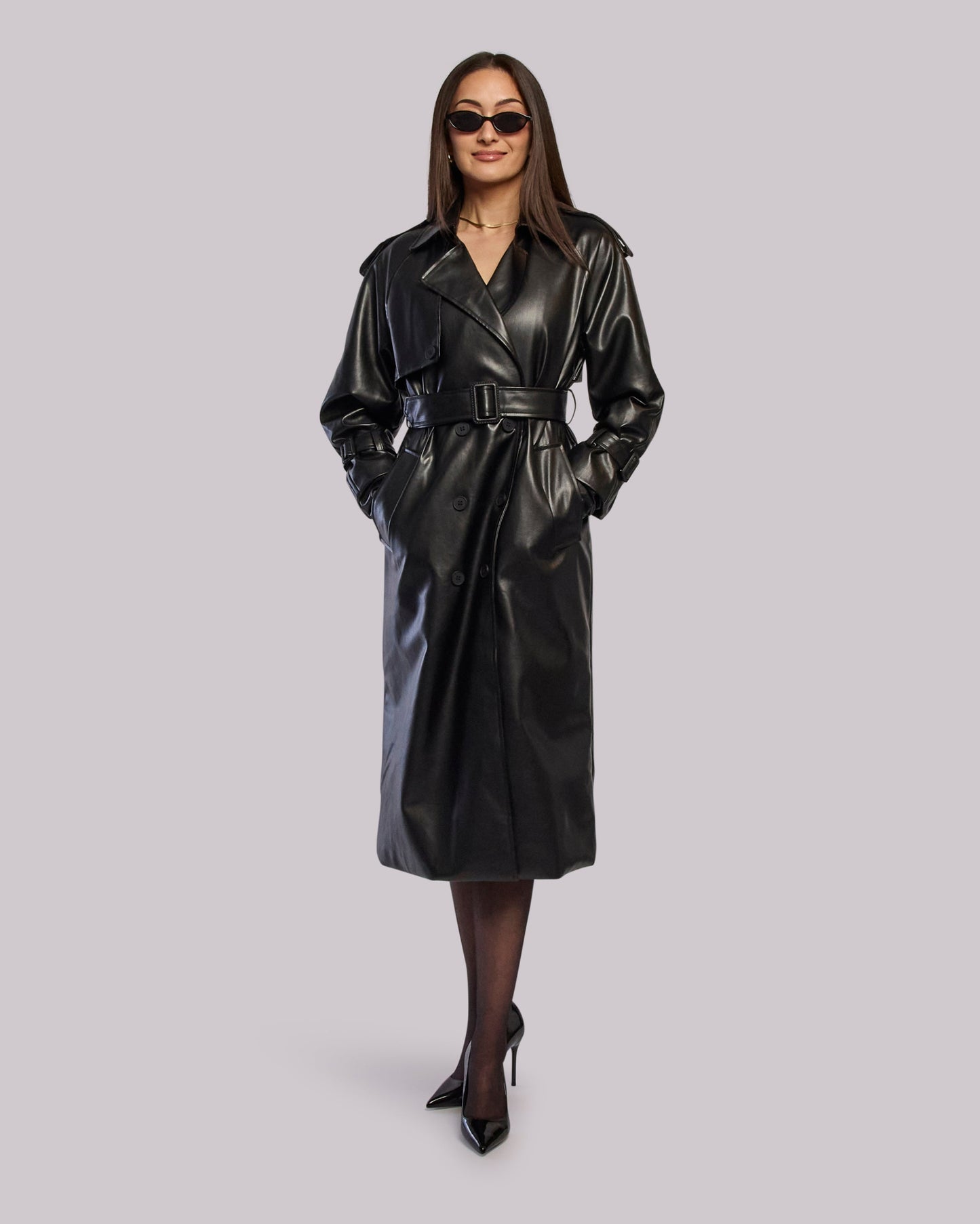 Model wearing Thunder leather trench coat standing with hands in pockets