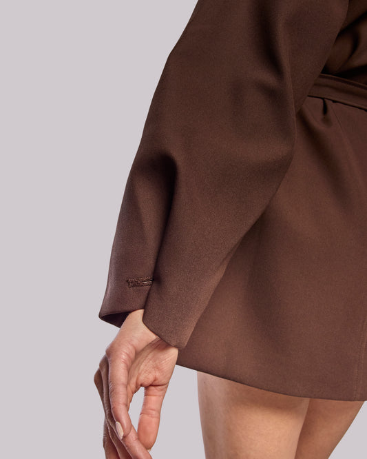 Model wearing Dawn brown wrap coat showing fabric
