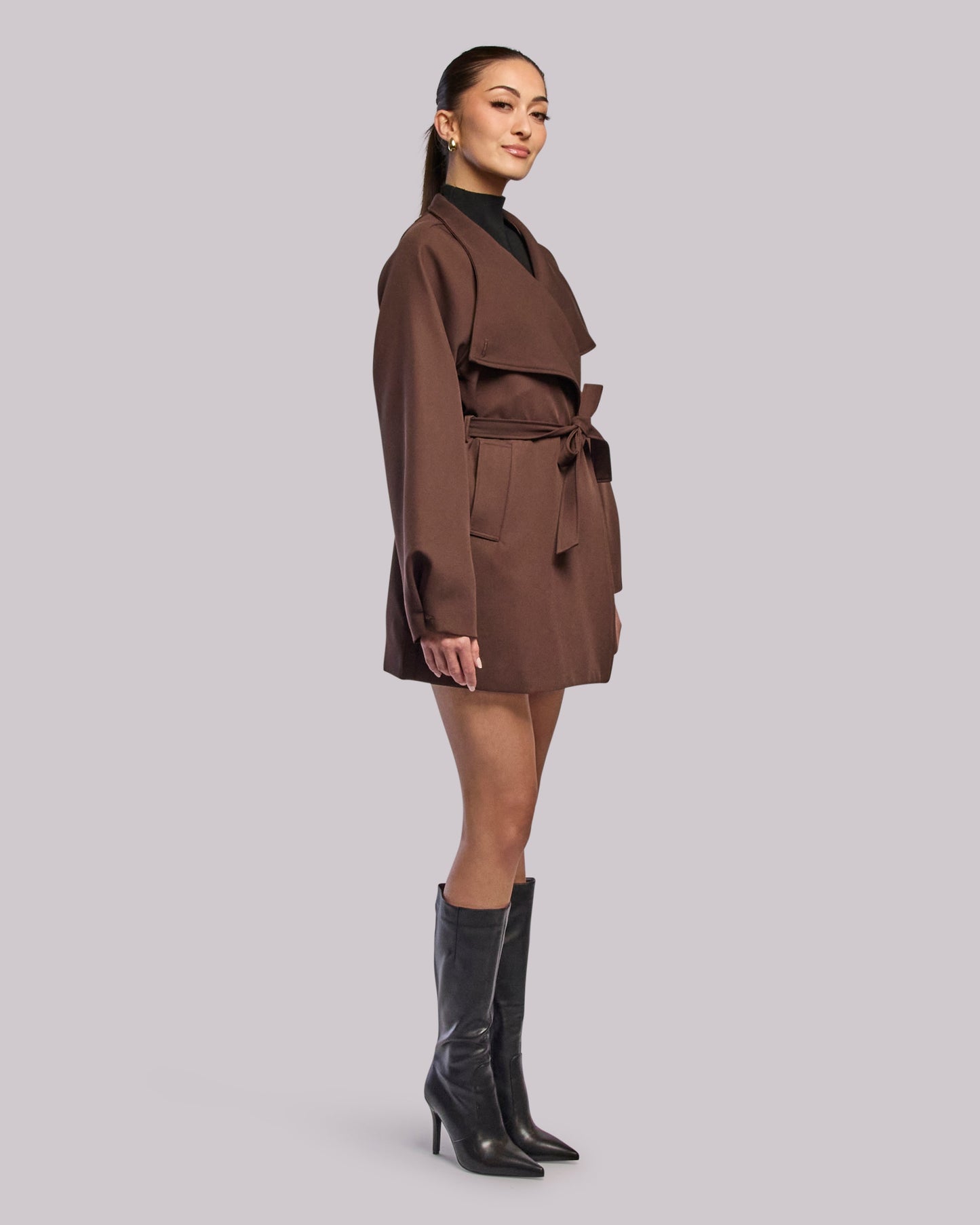 Model wearing Dawn brown wrap coat standing side angle