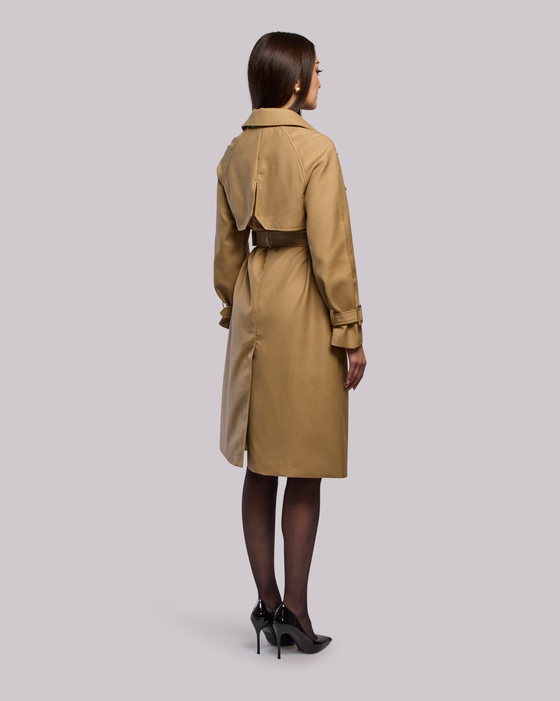 Model wearing Glory trench coat standing back angle