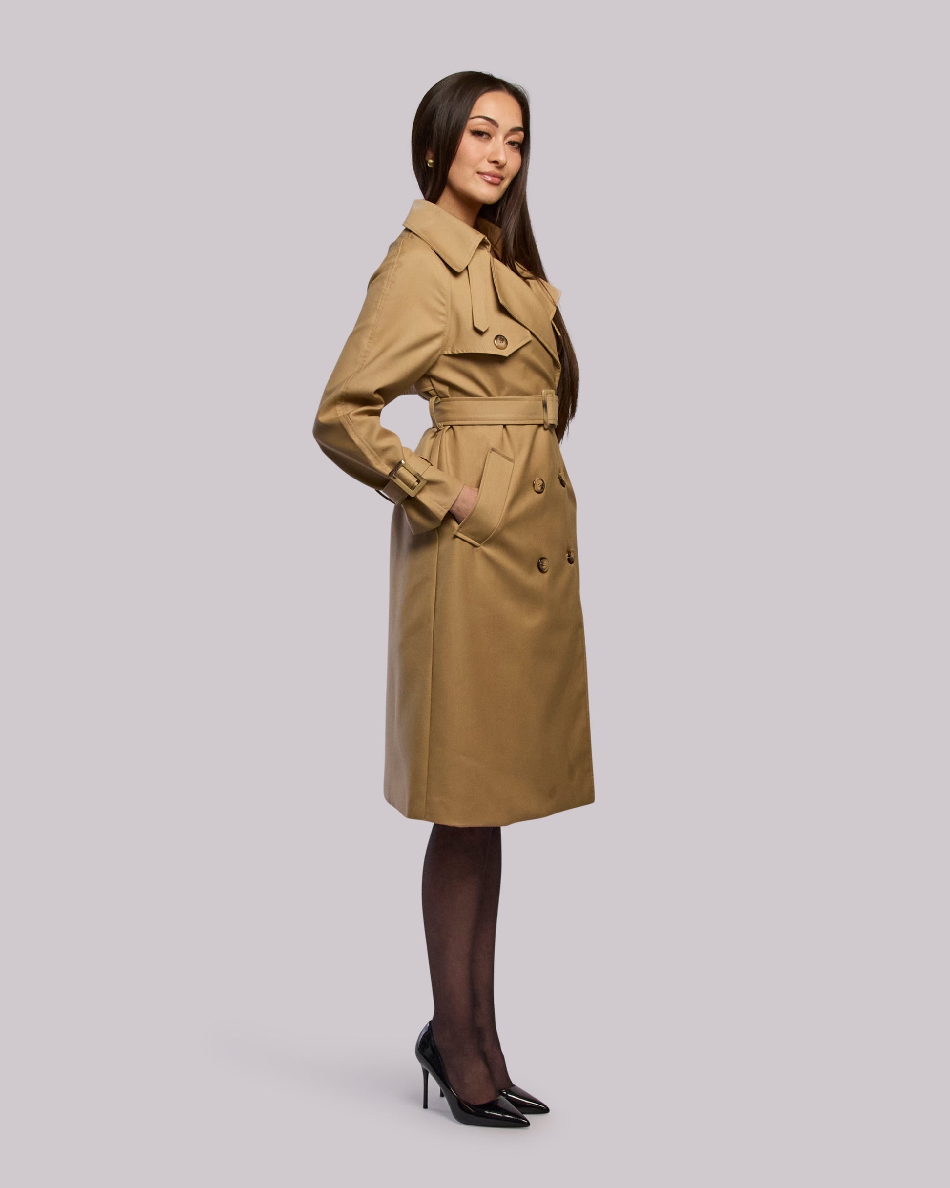 Model wearing Glory trench coat standing side angle