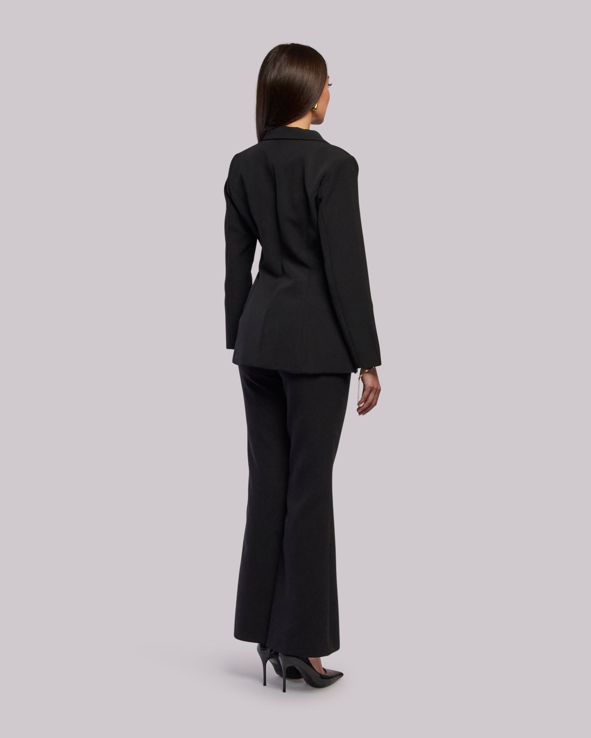 Model wearing Roar blazer standing back angle