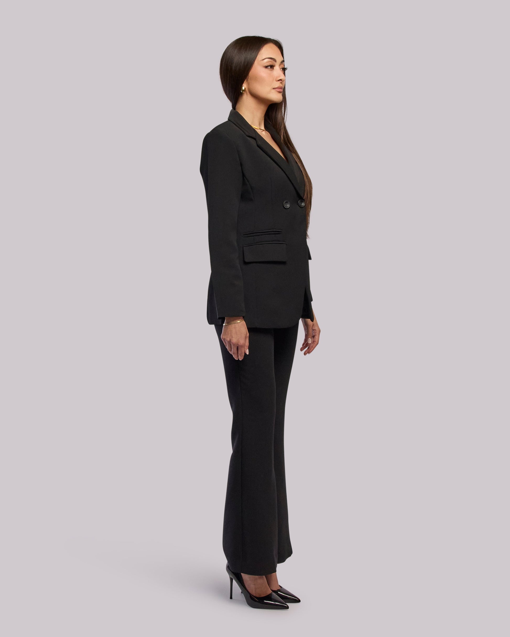 Model wearing Roar blazer standing side angle