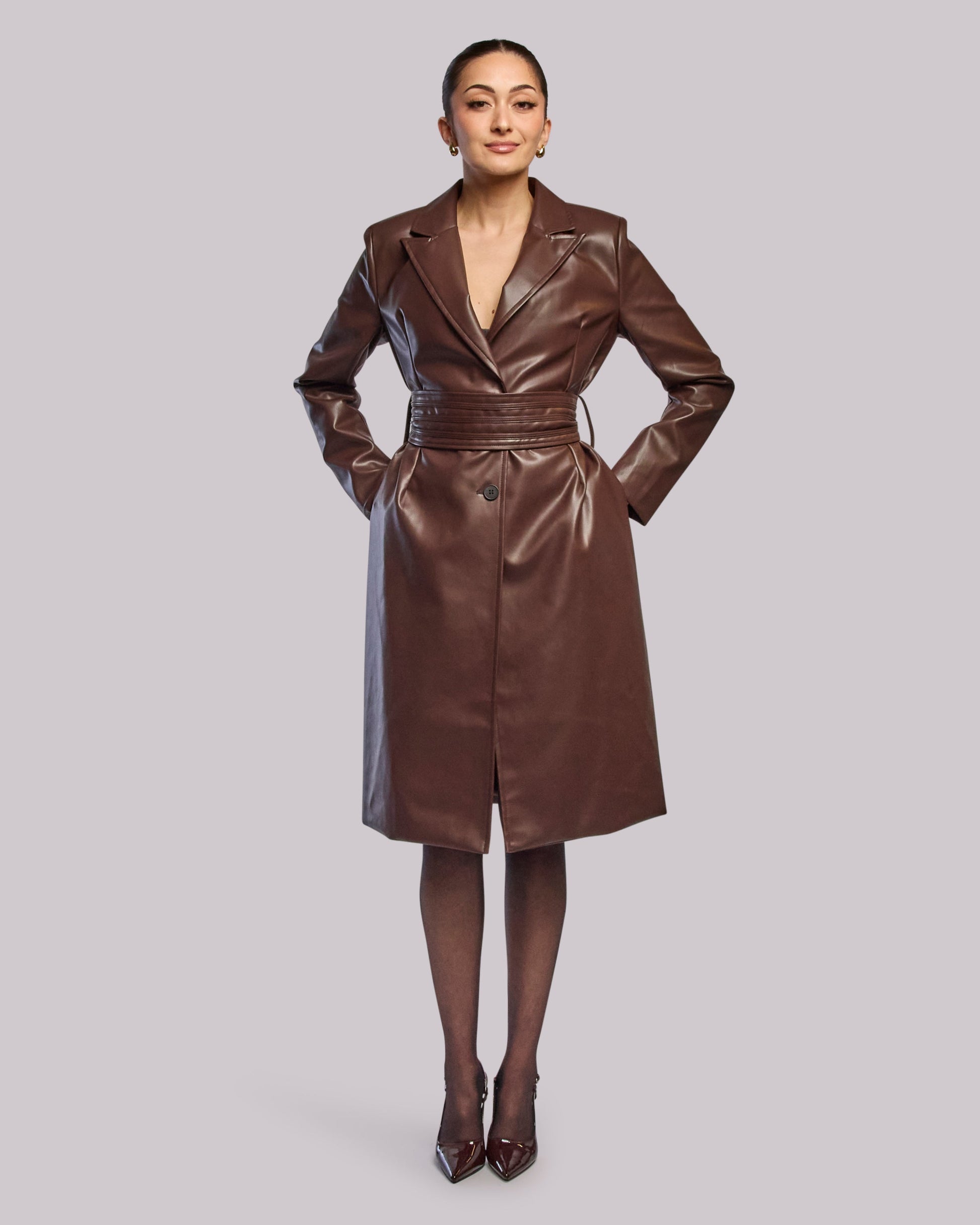Model wearing Storm long coat standing straight hands in pocket