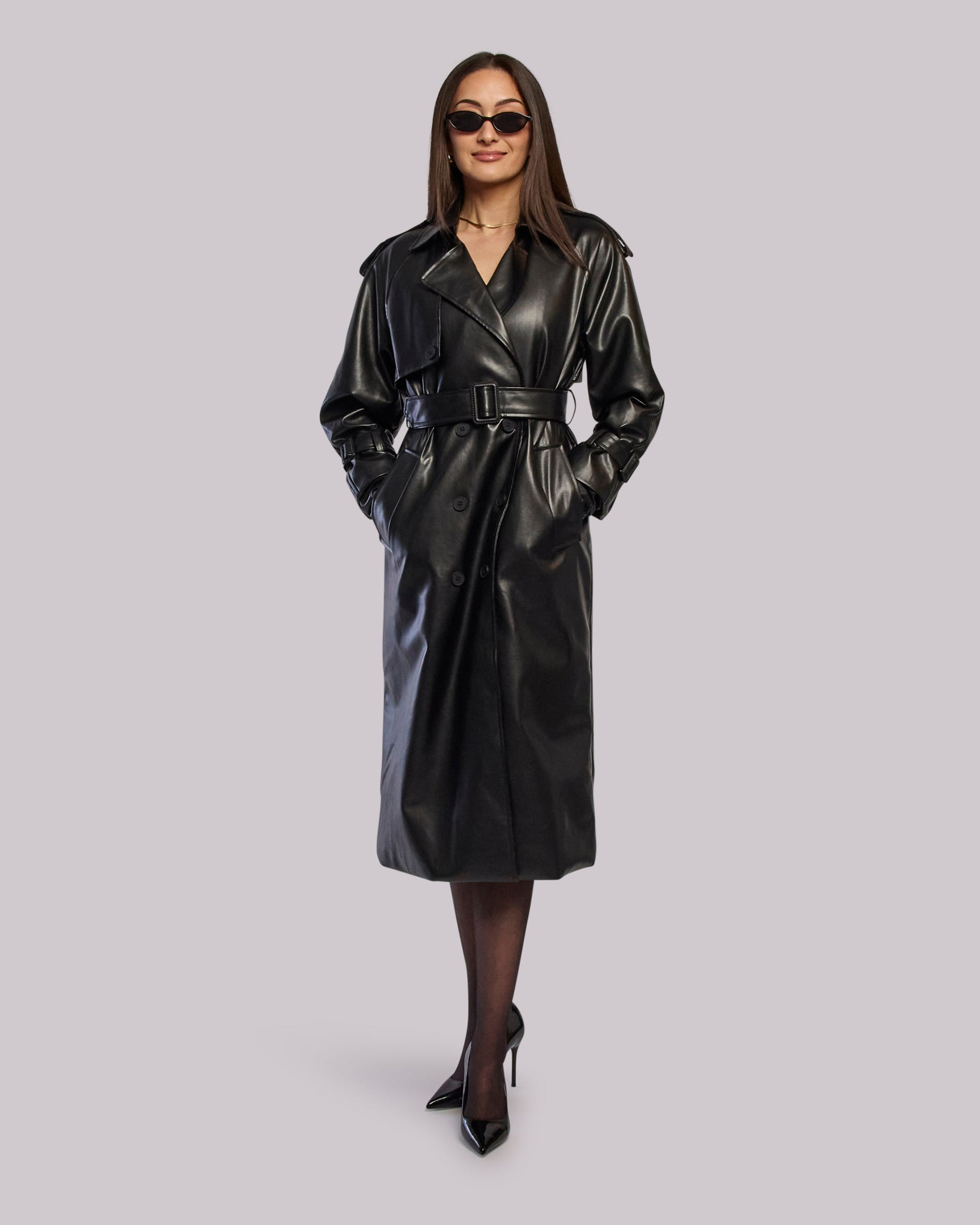 Model wearing Thunder leather trench coat standing with hands in pockets